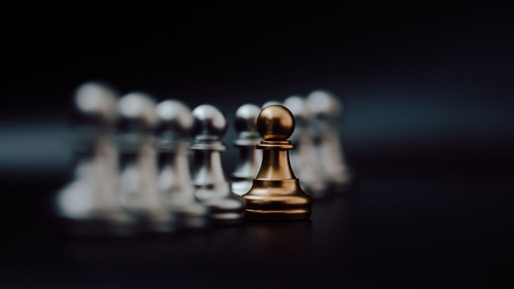 Leadership – gold pawn chess piece